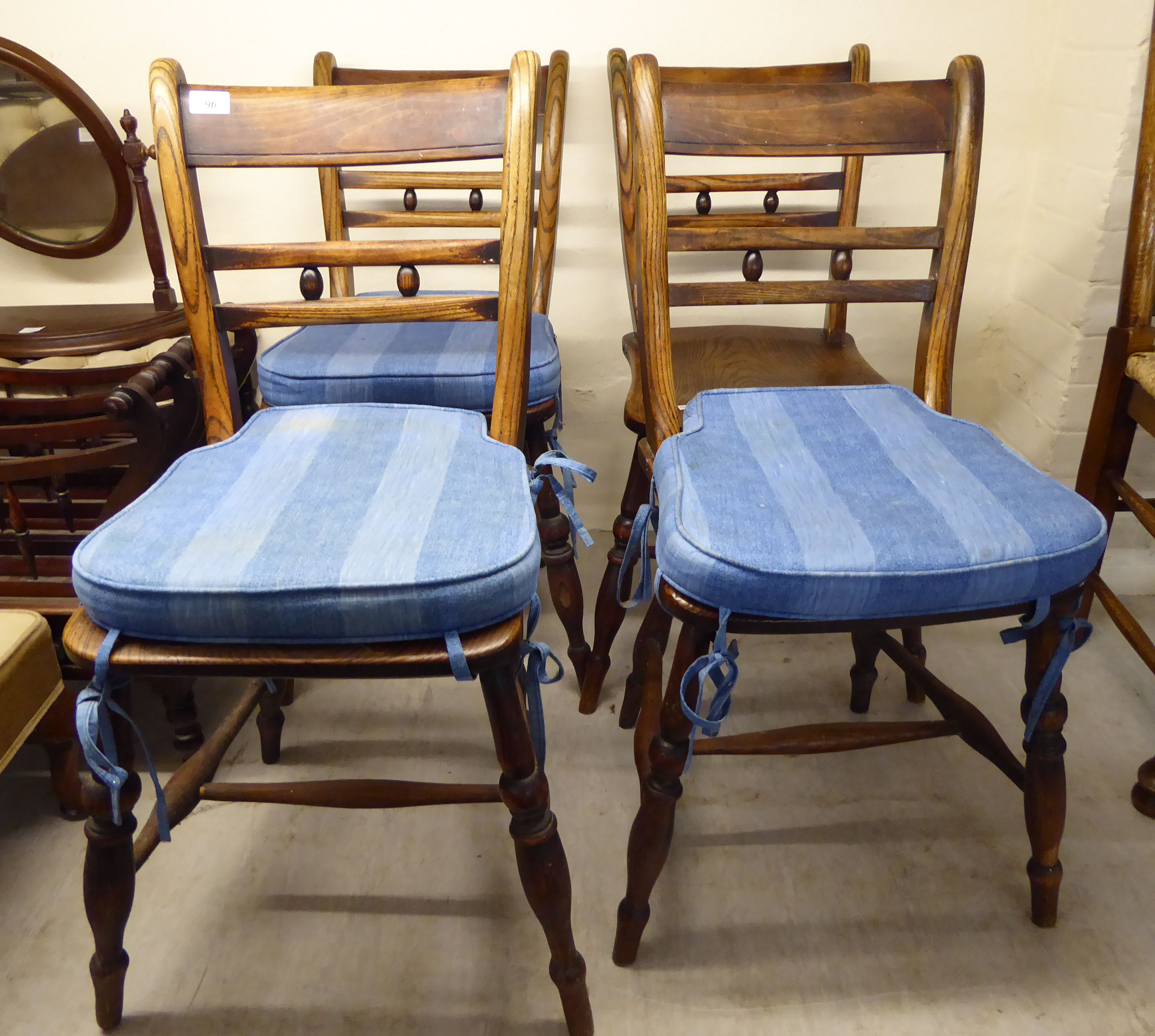 A matched set of four late 19thC country made beech and elm framed, twin bar back dining chairs,