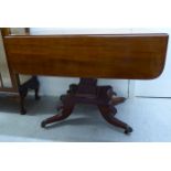A Regency mahogany Pembroke table, raised on a rectangular column and splayed,