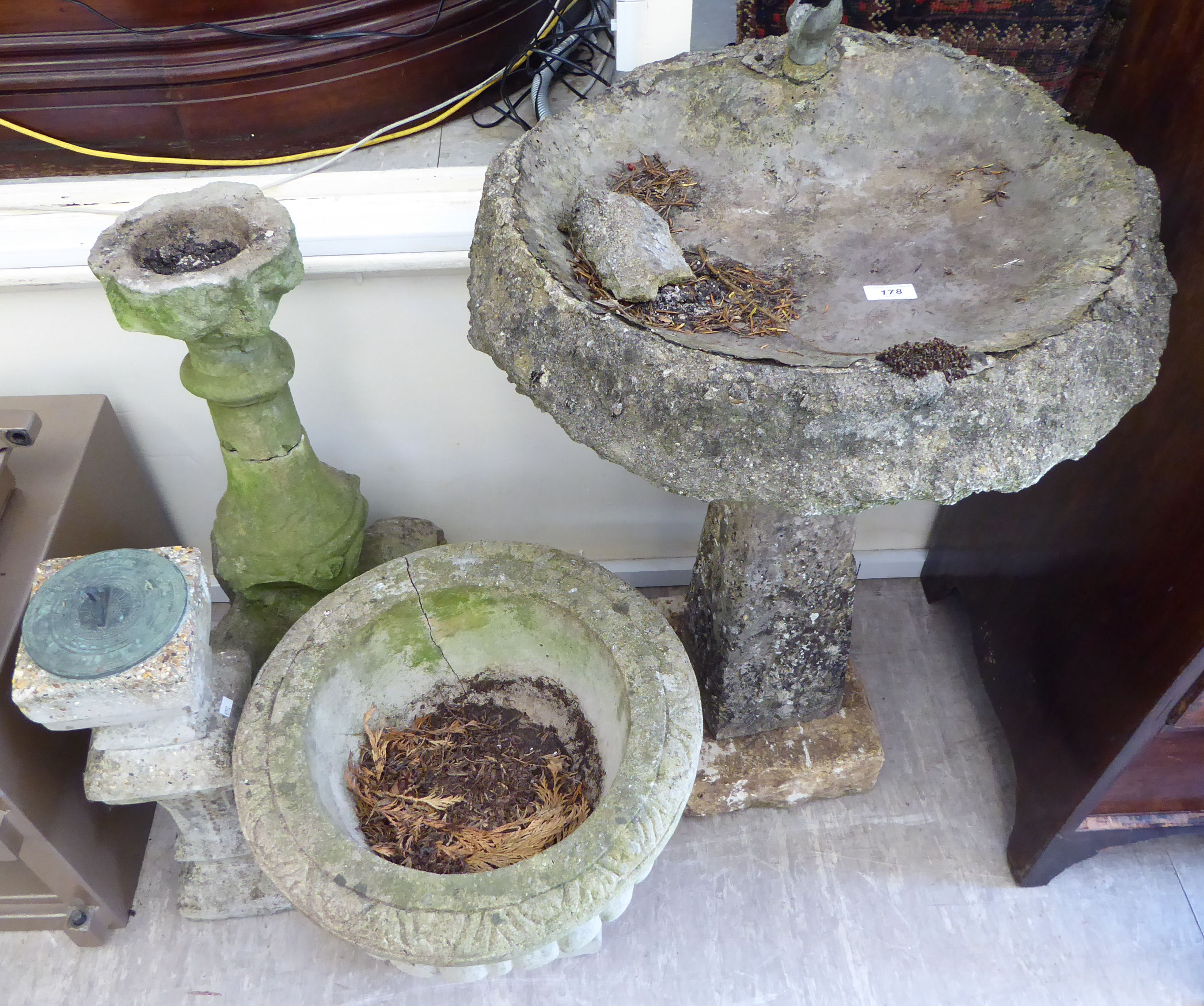 Composition stone garden ornaments and pots: to include a bird bath, on a square,