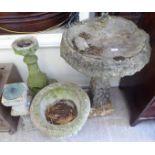 Composition stone garden ornaments and pots: to include a bird bath, on a square,