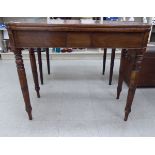 A George III string inlaid crossbanded mahogany card table,