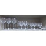 Slice decorated crystal stemmed drinking glasses comprising hocks,
