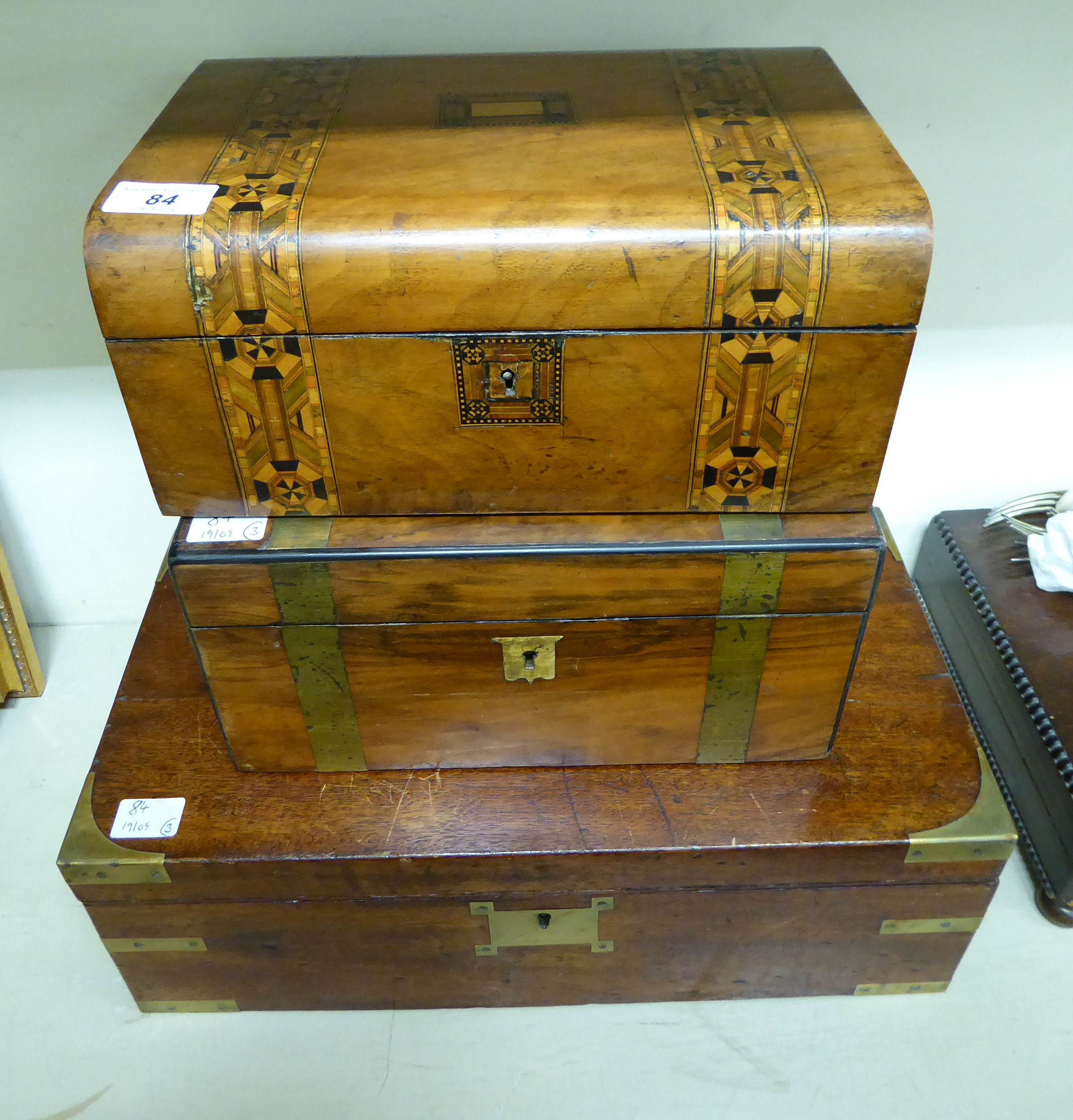 Three 19thC boxes: to include a military style brass bound mahogany writing slope 6''h 18''w
