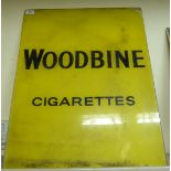 An early 20thC Woodbine cigarette advertising sign, reverse printed on coloured glass 25.