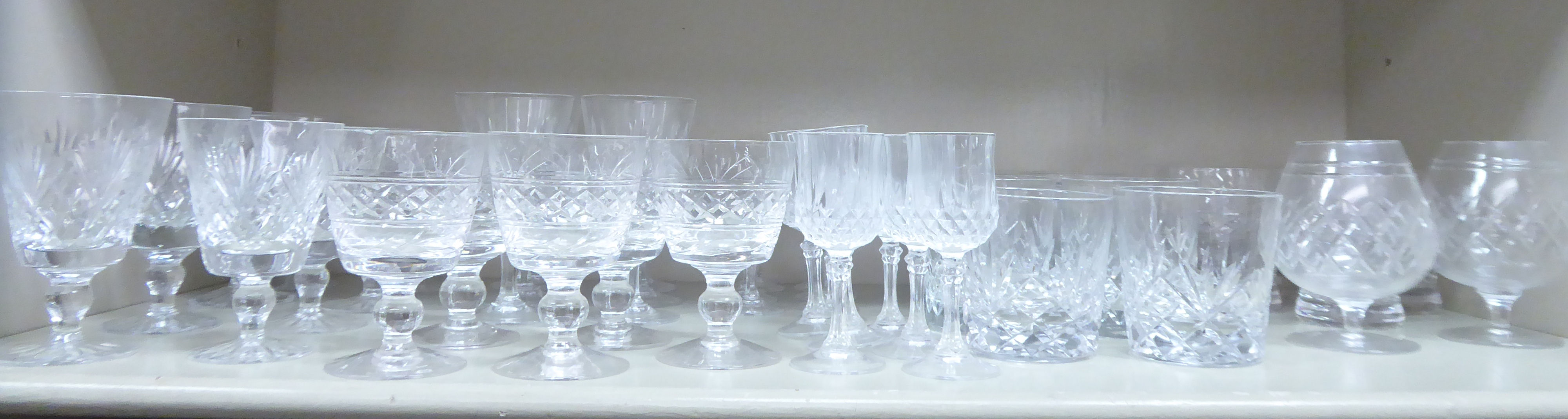 Slice decorated crystal stemmed drinking glasses comprising sherries,