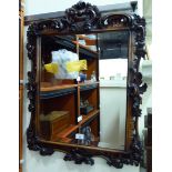 A late Victorian mirror, the bevelled plate,