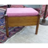 A modern rosewood framed stool with a pink fabric upholstered cushioned seat F