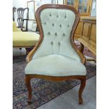 A modern stained beech showwood framed nursing chair,