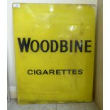 An early 20thC Woodbine cigarette advertising sign, reverse printed in yellow glass 25.