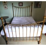 A late Victorian brass double bed frame with cast iron runners,
