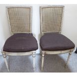 A pair of mid 20thC grey painted bedroom chairs with woven split cane backs and seats,