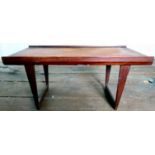 A 1970s Peter Lovig, Dansk, Denmark teak coffee table, raised on tapered legs,