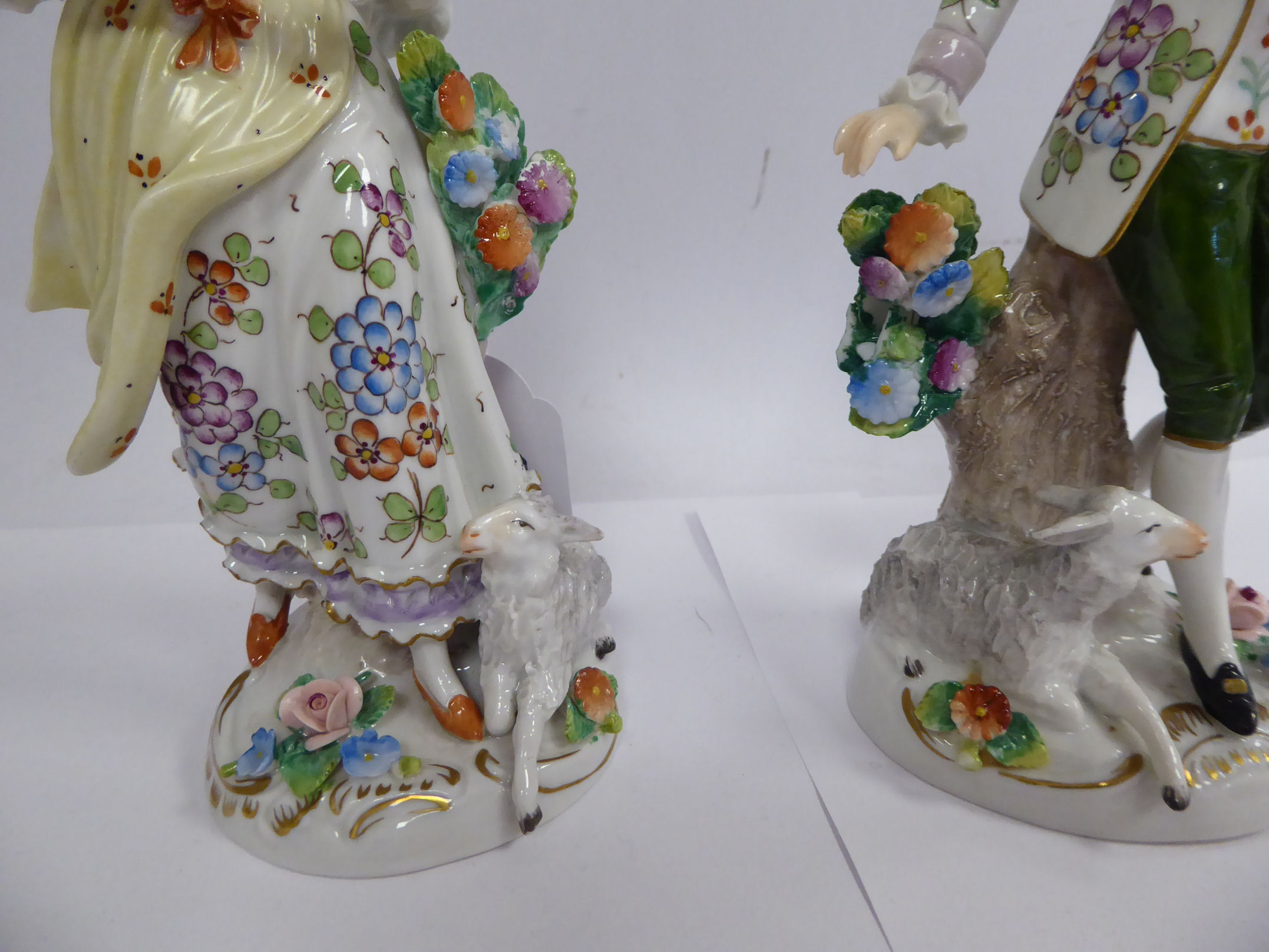 A pair of early 20thC Sitzendorf porcelain figures, a man and woman with lambs at their feet 7. - Image 3 of 4