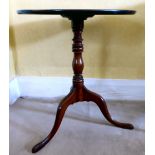 A George III mahogany pedestal table, the top with a thumb moulded edge, over a ring turned,
