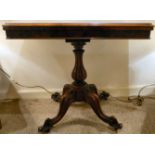 A mid Victorian walnut card table, the foldover top enclosing by a baize lined interior,
