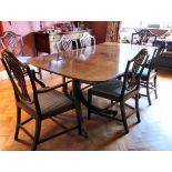 An early 20thC Regency design mahogany twin pedestal dining table with a three part top,