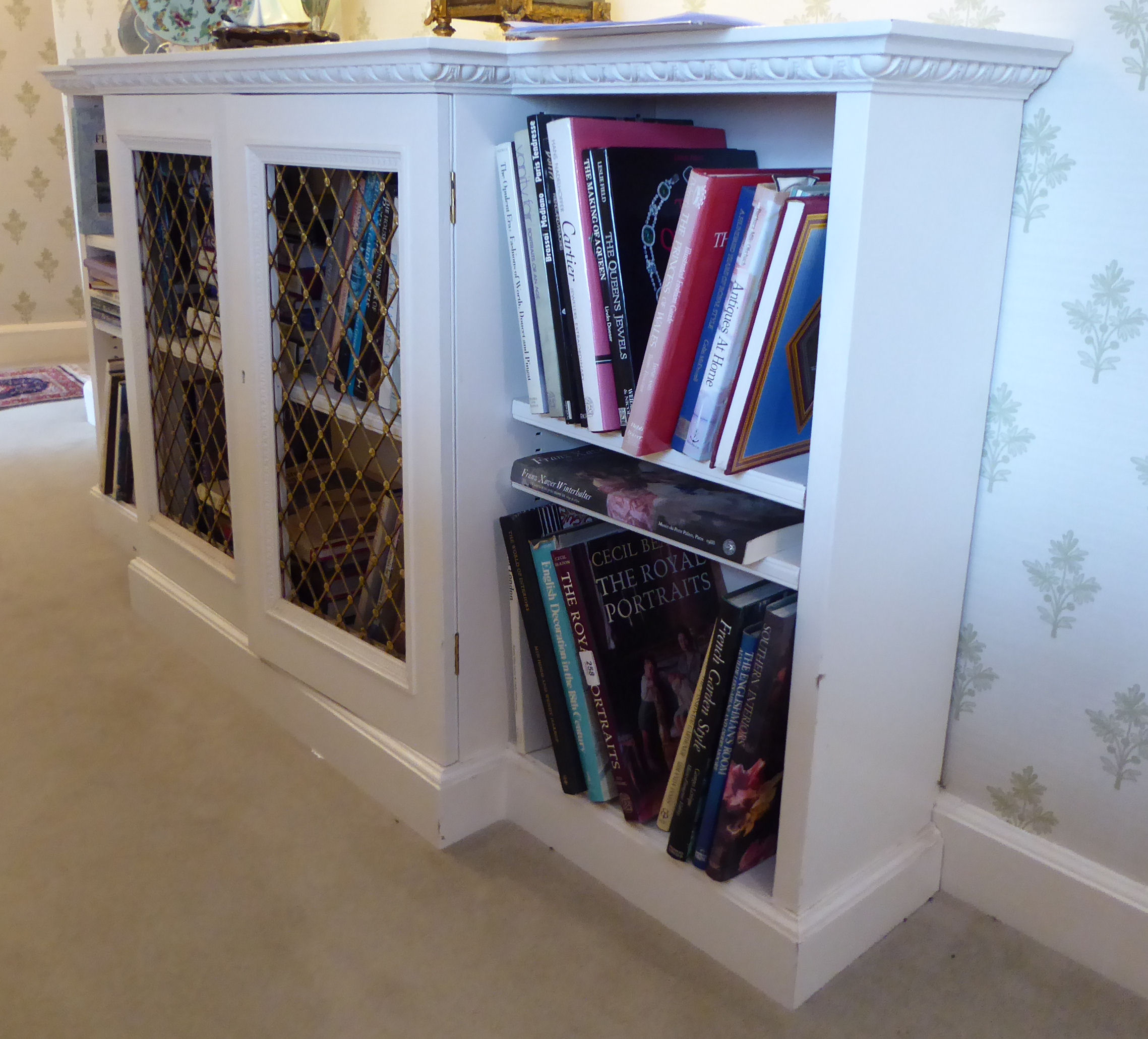 A mid 20thC white painted breakfront bookcase with two latticed brass central doors, - Image 2 of 2