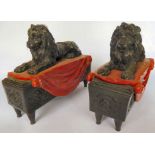 A pair of modern resin mantel sidepieces, each fashioned as a lion,