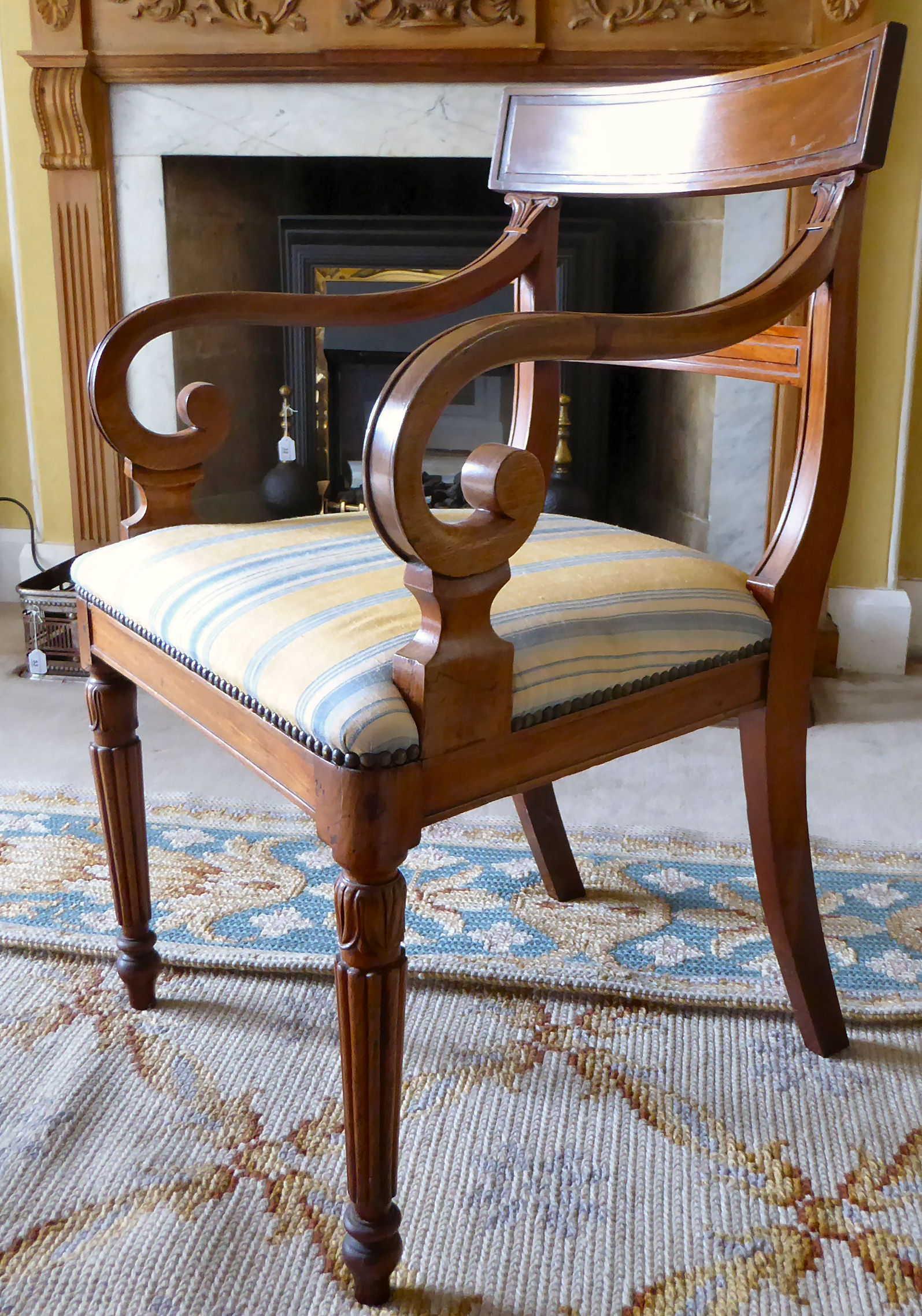 An early 20thC Regency design mahogany framed elbow chair with a stripe upholstered seat, - Image 2 of 3