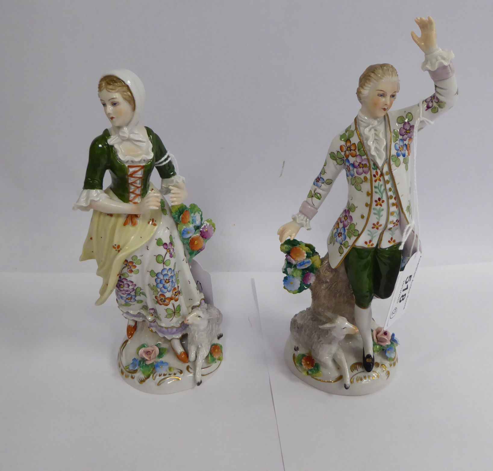 A pair of early 20thC Sitzendorf porcelain figures, a man and woman with lambs at their feet 7.