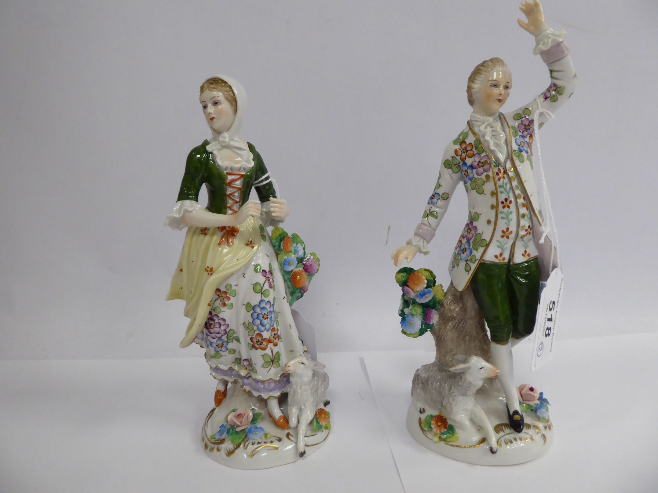 A pair of early 20thC Sitzendorf porcelain figures, a man and woman with lambs at their feet 7. - Image 2 of 4