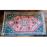 A Persian design rug, decorated with stylised animals and flora,