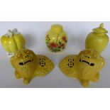 A pair of 20thC Chinese inspired yellow glazed pottery dragons 5''h;