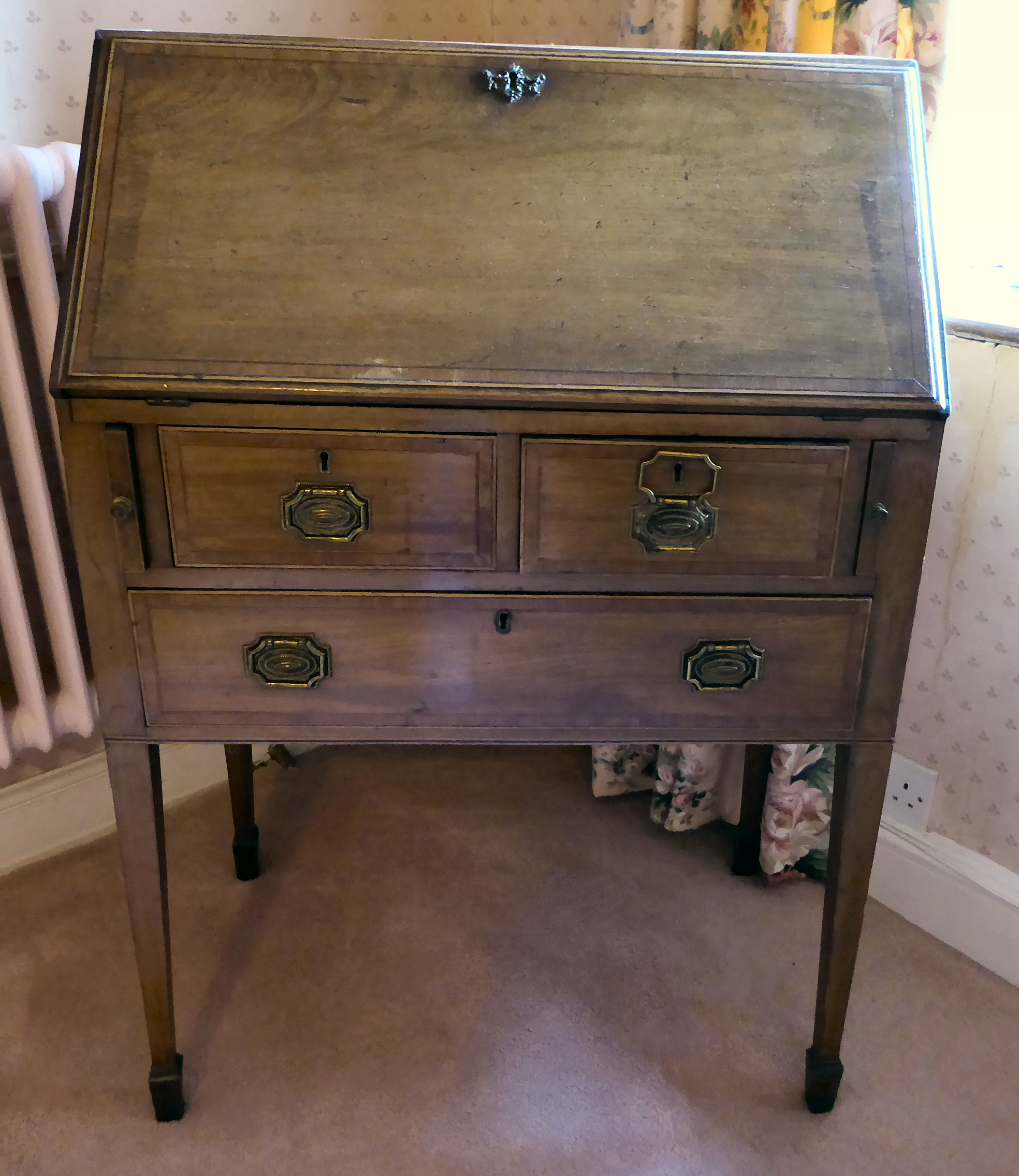 An Edwardian satinwood inlaid mahogany bureau, the fall front, enclosing a fitted interior,