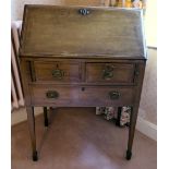 An Edwardian satinwood inlaid mahogany bureau, the fall front, enclosing a fitted interior,