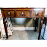 A Regency satinwood inlaid mahogany side table with a central facsimile drawer,