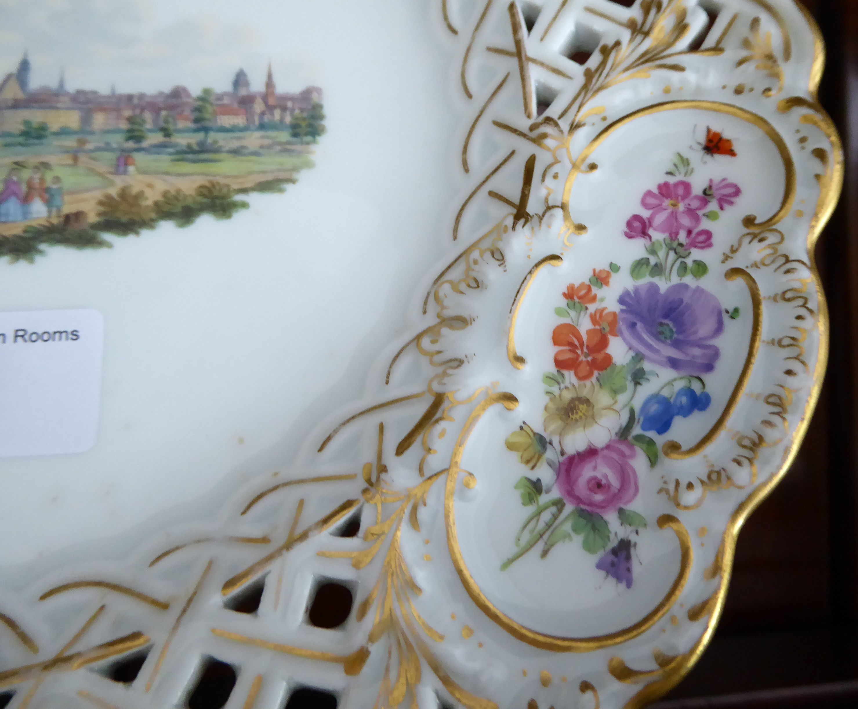 An early 20thC Meissen porcelain latticed plate with floral cartouches and figures wearing period - Image 2 of 6