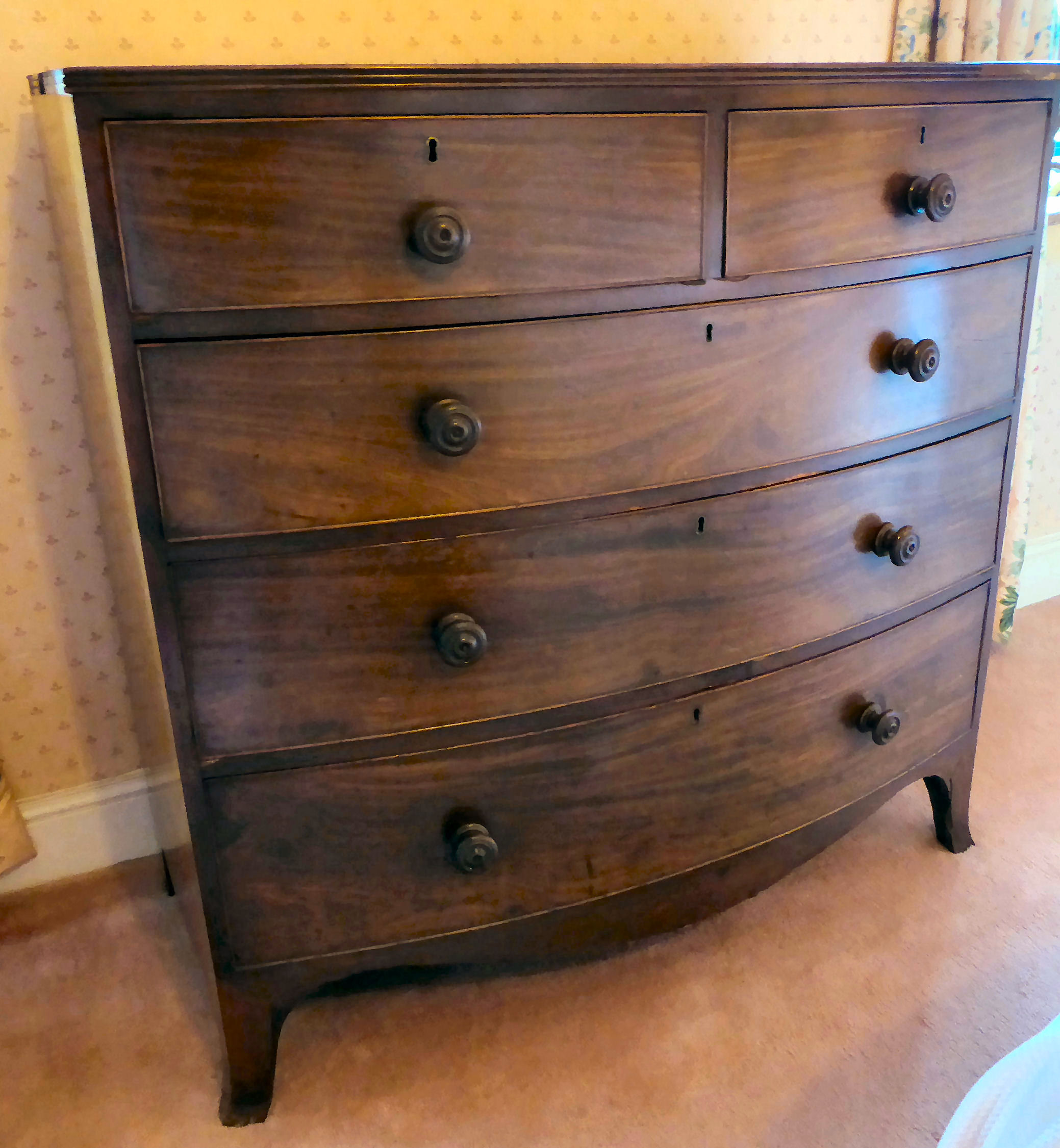 A Regency mahogany bow front dressing chest with two short/three graduated long drawers,