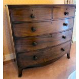 A Regency mahogany bow front dressing chest with two short/three graduated long drawers,