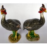 A pair of mid 20thC Continental porcelain models of peacocks 10''h (From the Ian Thomas