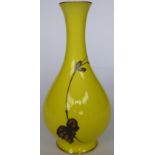 A 20thC Continental porcelain vase with a slender, waisted neck, decorated in gilt with foliage,