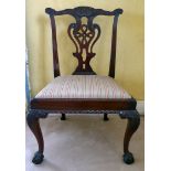 An early 20thC Chippendale design mahogany framed dining chair with a carved crest and a pierced