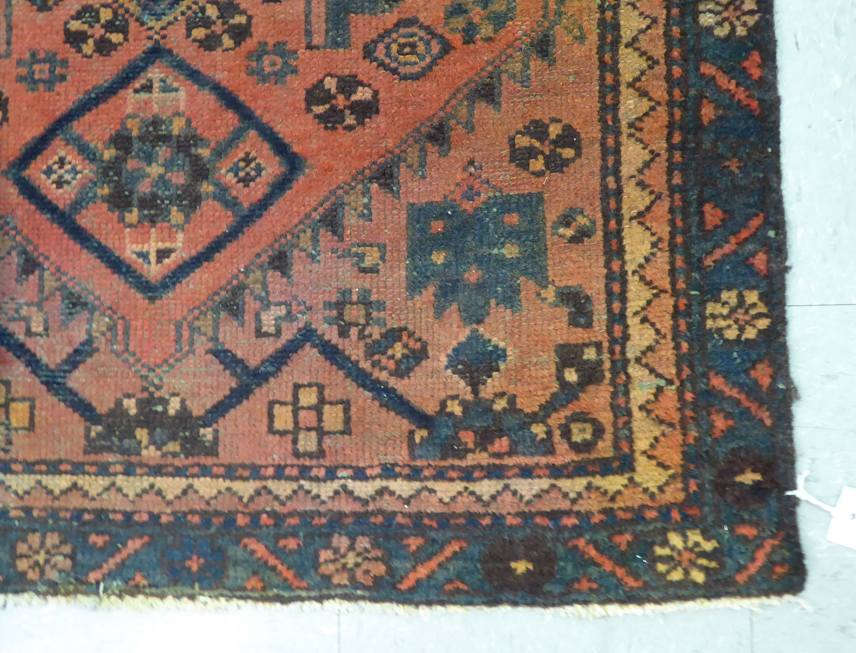 A Caucasian rug, decorated with a central medallion and stylised designs, - Image 2 of 3