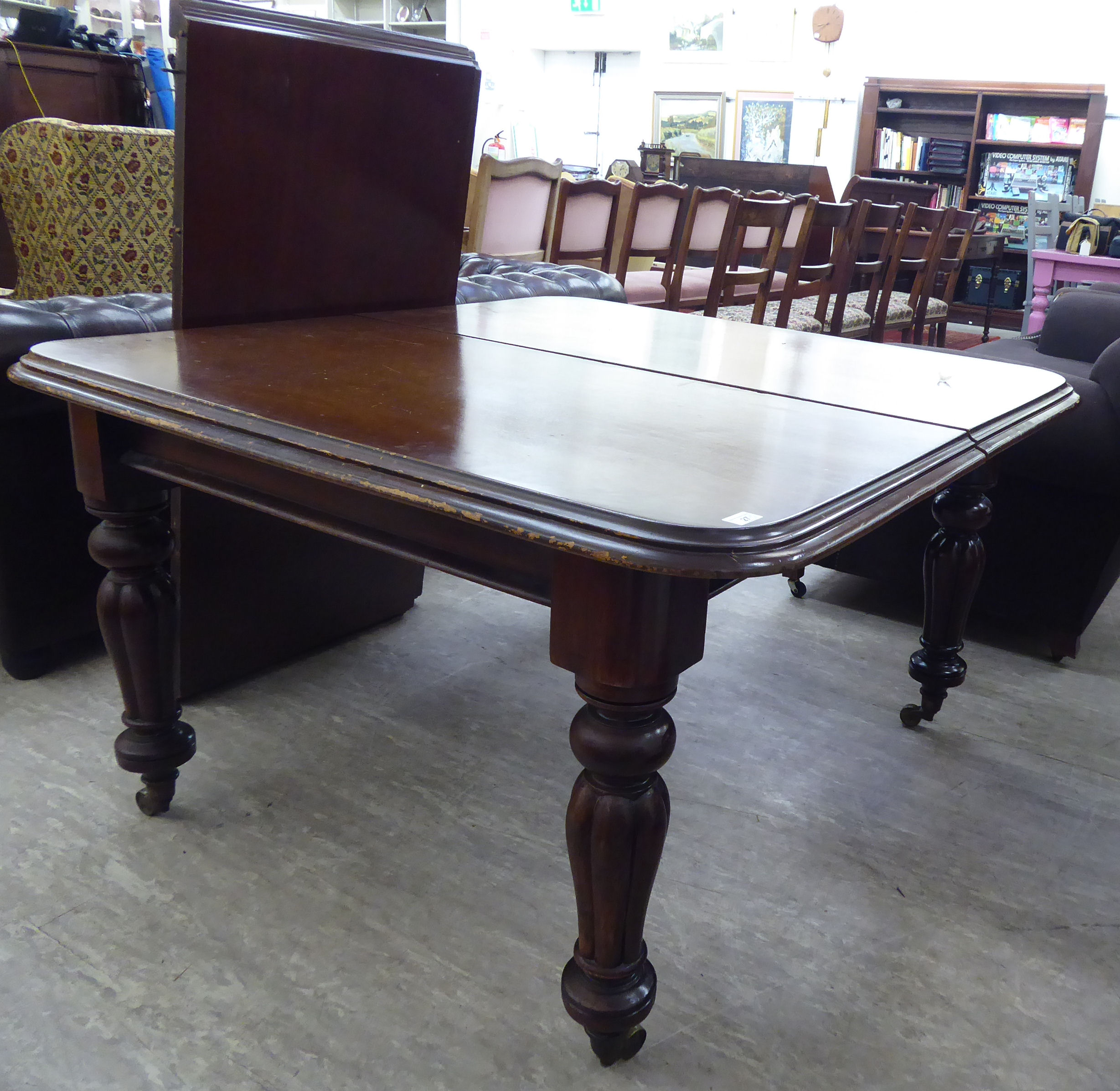 An early/mid 19thC mahogany wind-out dining table, the top with a two tier, thumb moulded edge,