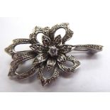 A platinum petal design brooch,