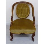 A mid Victorian moulded and carved walnut showwood framed, round back salon chair with swept,