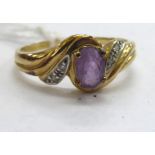 A 9ct gold amethyst and diamond set crossover ring 11