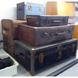 Six early 20thC stitched hide and canvas bound cabin trunks and suitcases various sizes BS