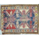 A Shirvan rug, decorated with repeating stylised designs,