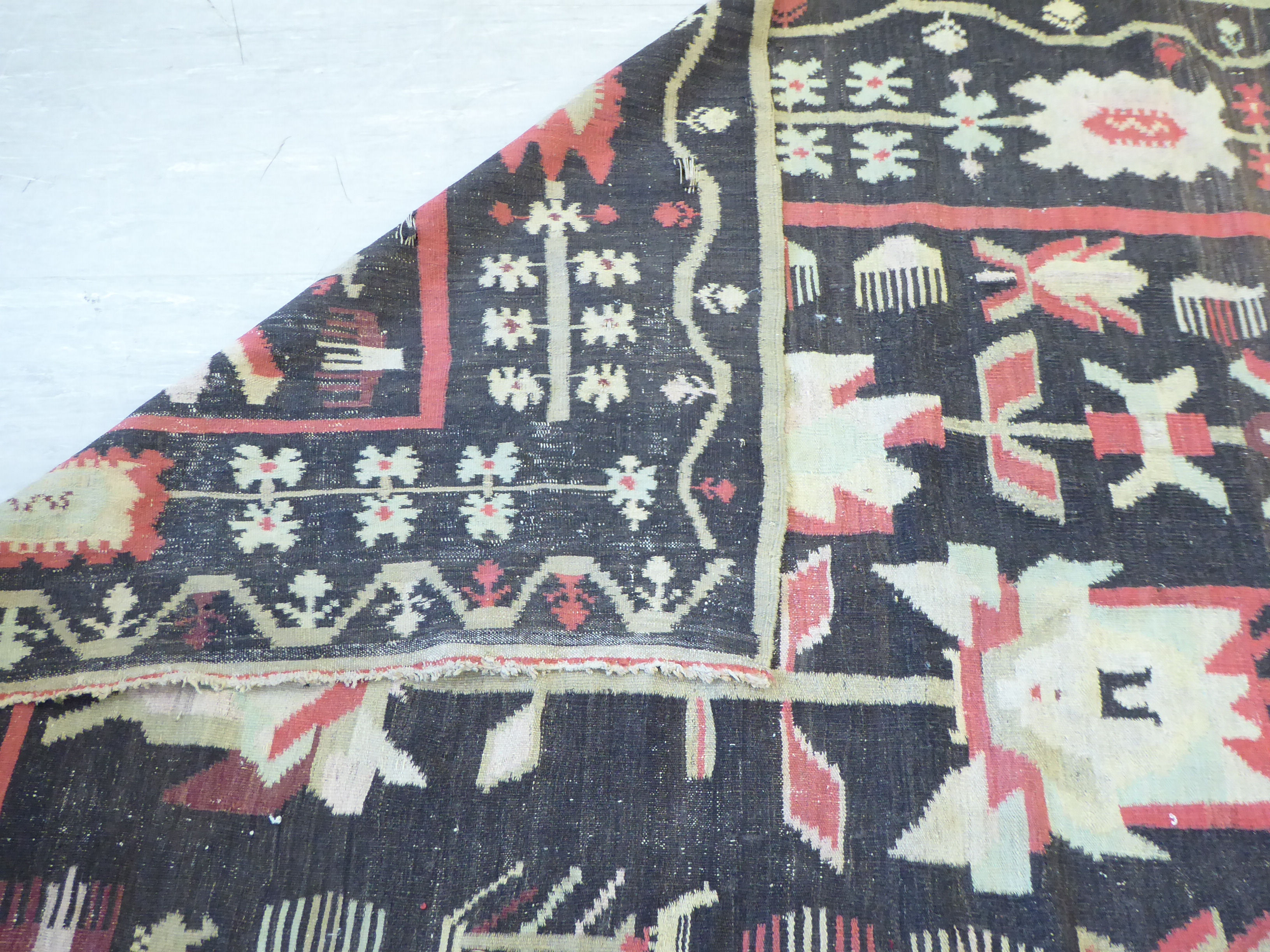 A Caucasian Kelim carpet, decorated with stylised abstract designs, - Image 3 of 3
