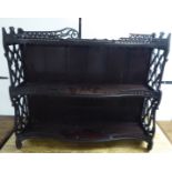 A late Victorian mahogany serpentine front three tier hanging shelf unit 26''h 31''w BSR