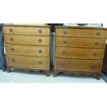 A pair of early 20thC crossbanded mahogany bow front, four drawer dressing chests,