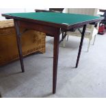 A mid 20thC stained beech framed card table, raised on folding, square,