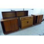 Four 1970s teak living room units: to include one with sliding doors,