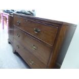 A late 19thC crossbanded mahogany three drawer dressing chest,