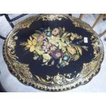 A late Victorian papier mache occasional table, the top having a lobed edge,